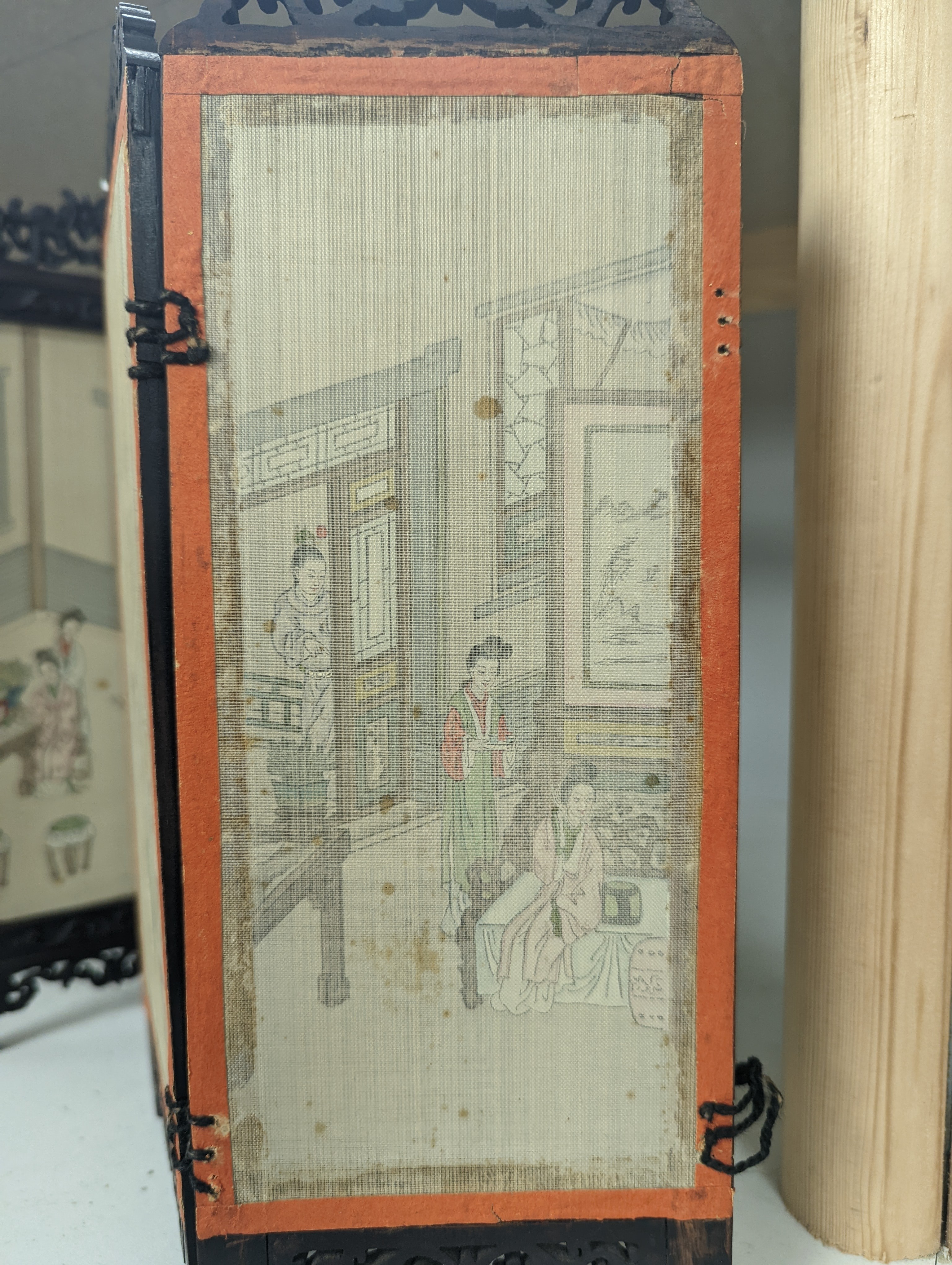 A Chinese hardwood framed painted silk four fold miniature screen, inset with painted silk panels, 28cm